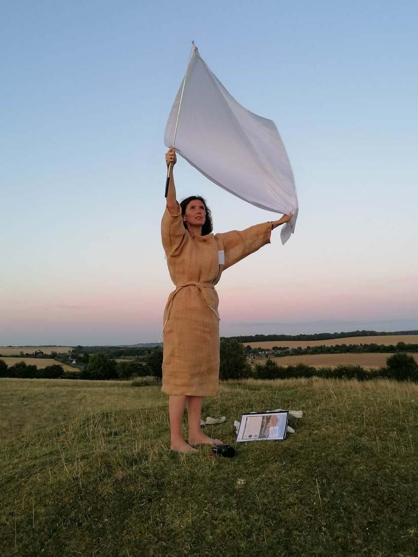 The white flag raised at dusk